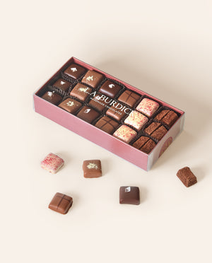 Burgundy box of assorted chocolate covered caramel bonbons.