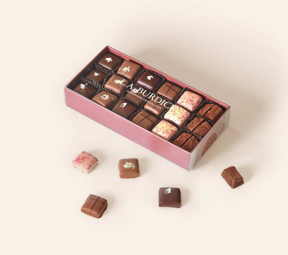 Burgundy box of assorted chocolate covered caramel bonbons.