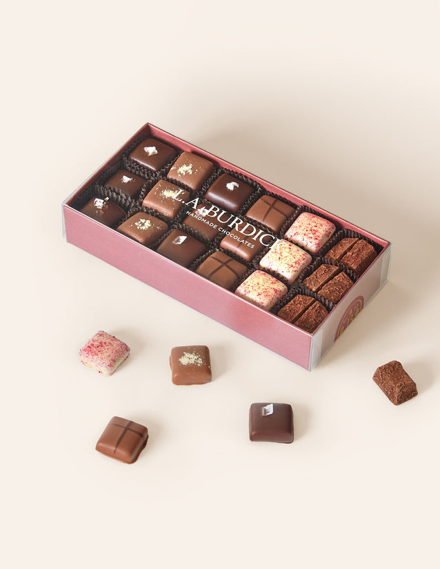 Burgundy box of assorted chocolate covered caramel bonbons.