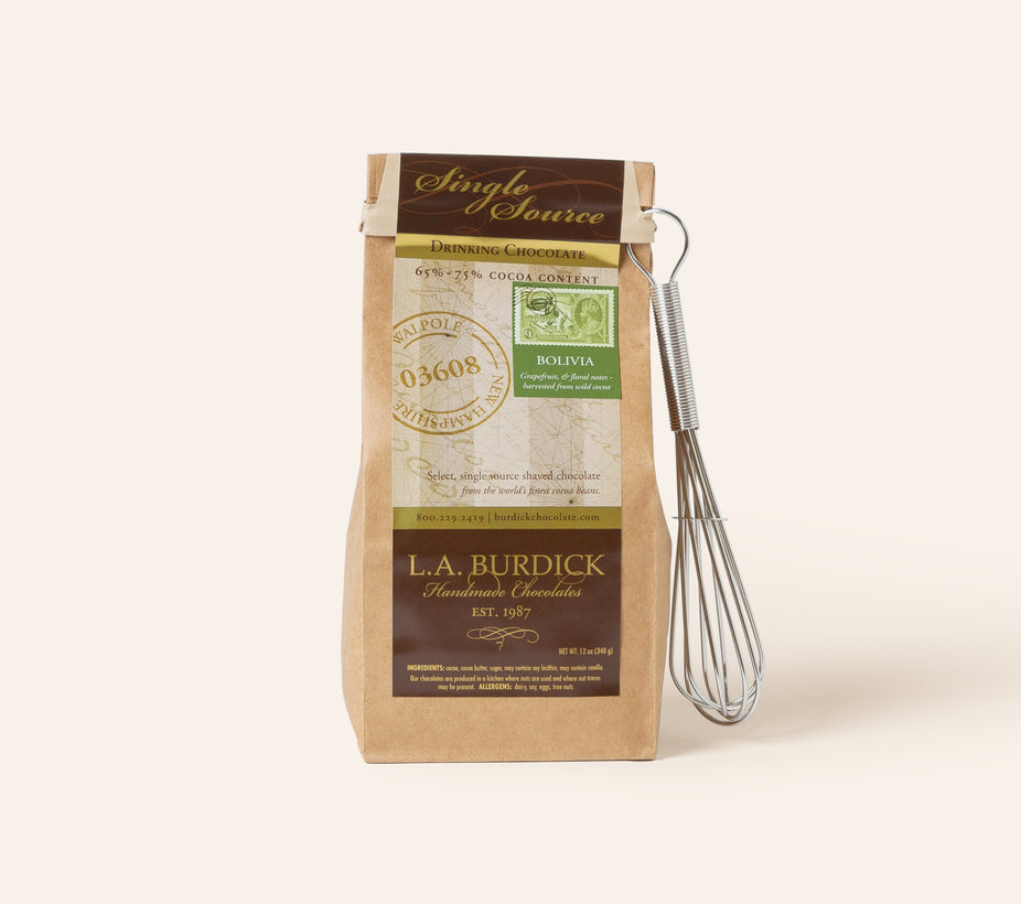 Bag of L.A. Burdick chocolate with a whisk on a cream background