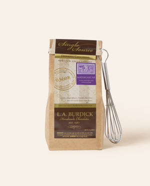 Bag of drinking chocolate on a cream background.