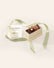 Milk Chocolate Elephant with white chocolate tusks tucked into a gift box and finished with a green satin ribbon.