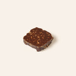 Square dark chocolate bonbon.