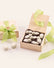 Eight pieces of white chocolate sheep in a wooden gift box with green ribbon