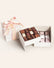 Spring Bonbon Assortment of fruit and floral bonbons in a white two-tiered gift box with pink ribbon.