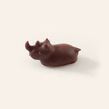 Dark chocolate rhino on a cream background