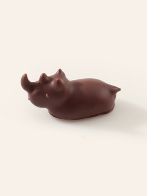Dark chocolate rhino on a cream background